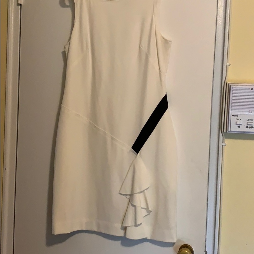 White dress with a black line on the side